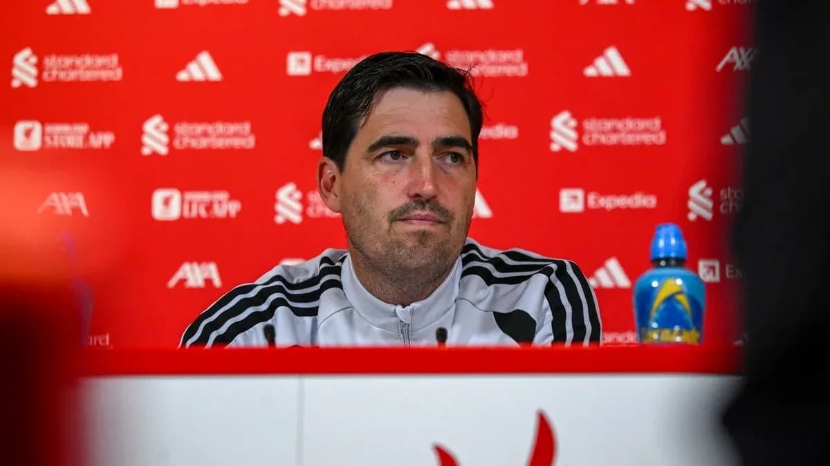 Manager at press conference with red background