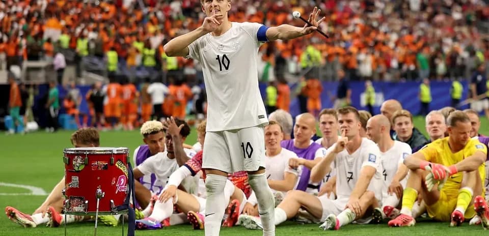 Player signaling to crowd during post-match celebration