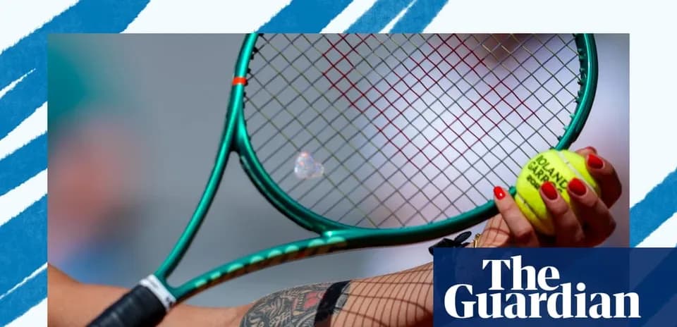 Close-up of tennis racket and ball in hand