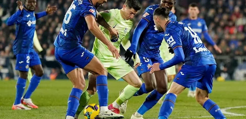 Getafe players contesting the ball against Mallorca