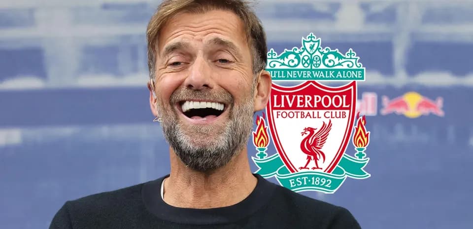 Manager smiling during Liverpool press conference
