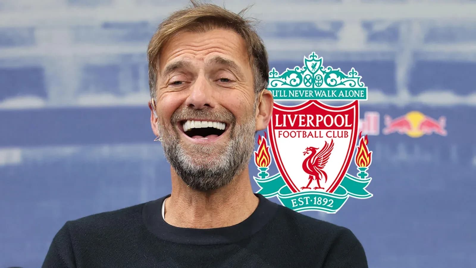 Manager smiling during Liverpool press conference