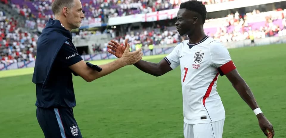 Coach and player shaking hands after the match