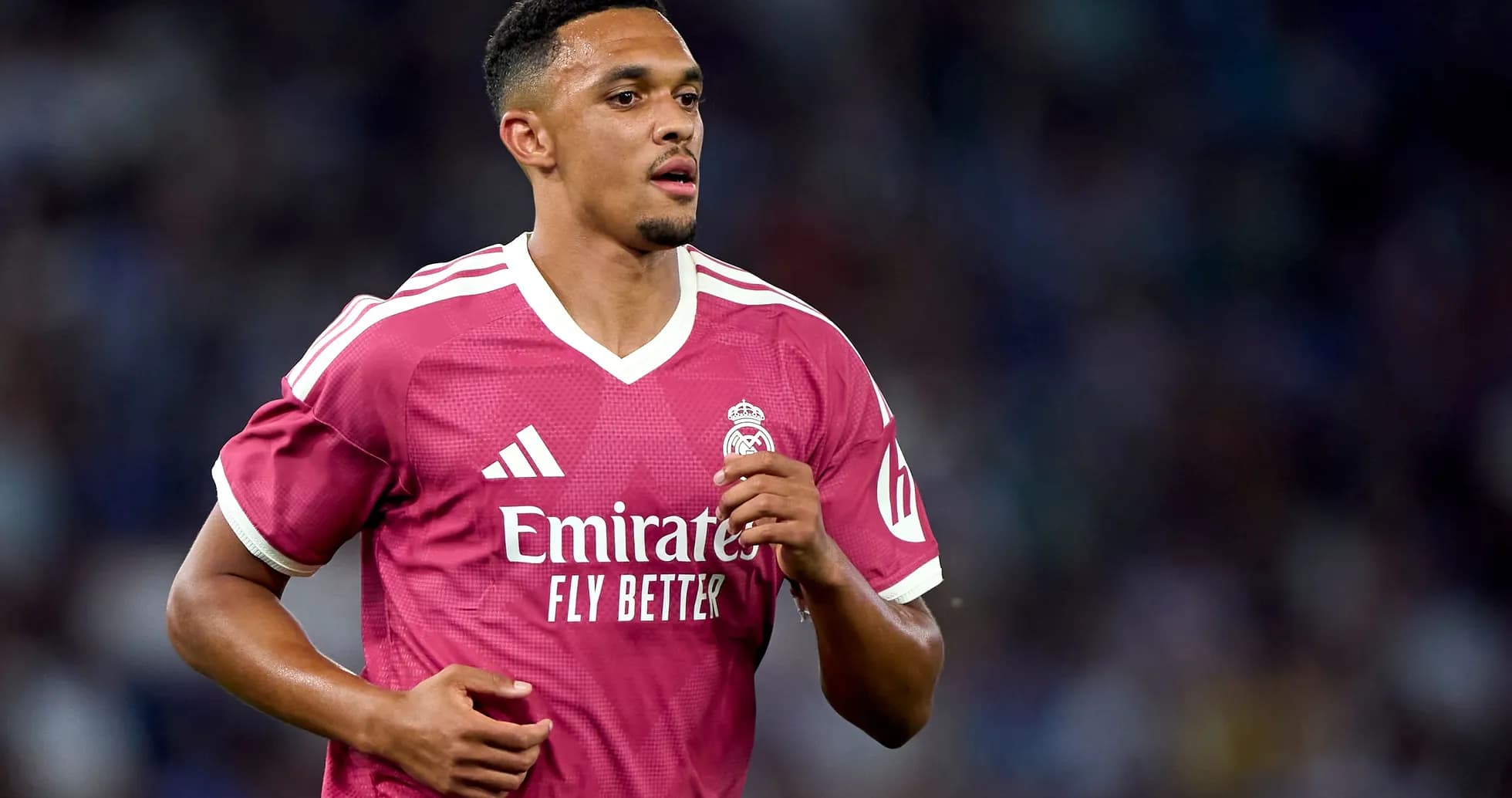 Player in pink Real Madrid jersey during match