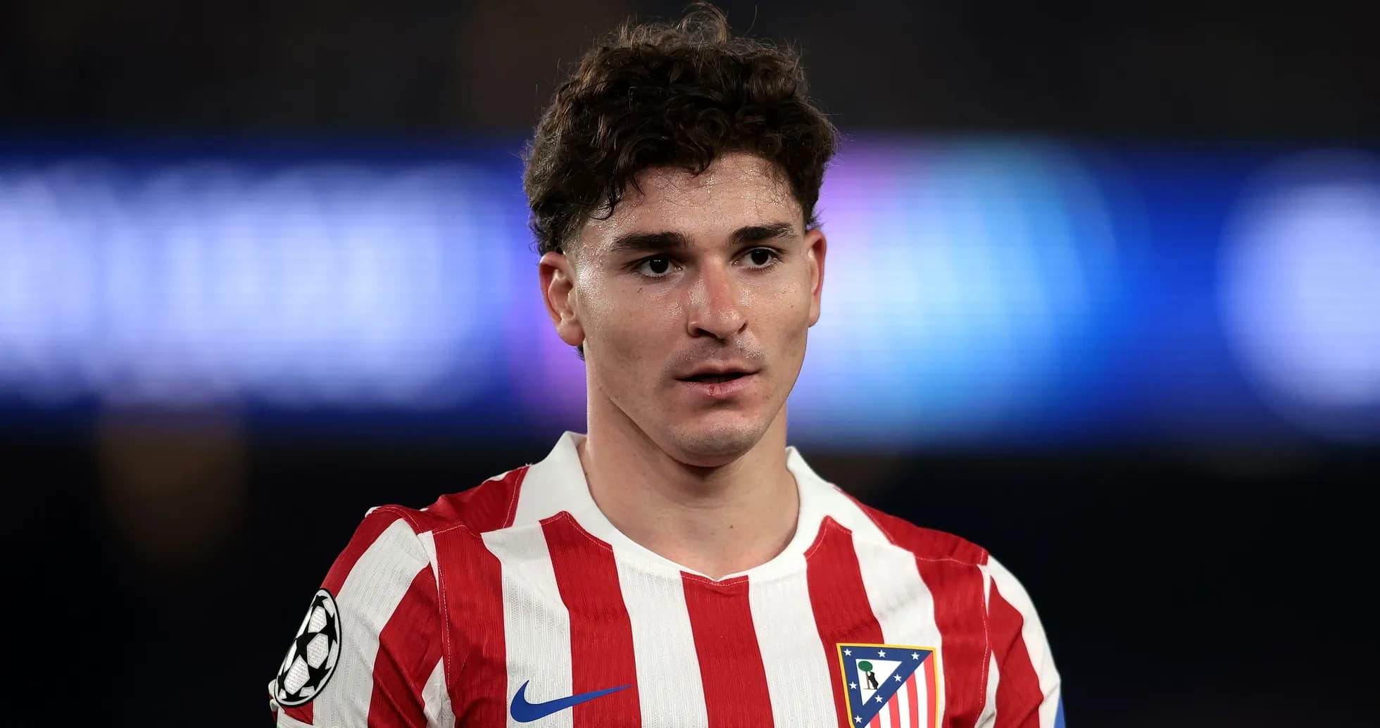 Player wearing Atletico Madrid jersey on field
