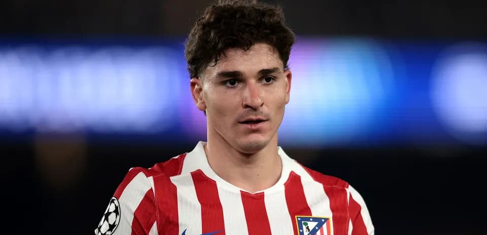Player wearing Atletico Madrid jersey on field
