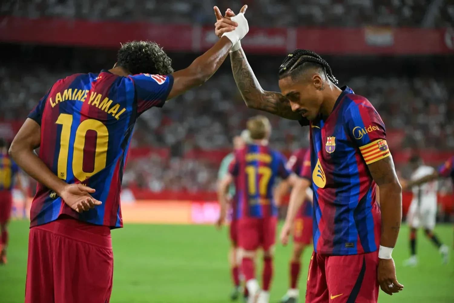 Players celebrating during Sevilla vs Barcelona match