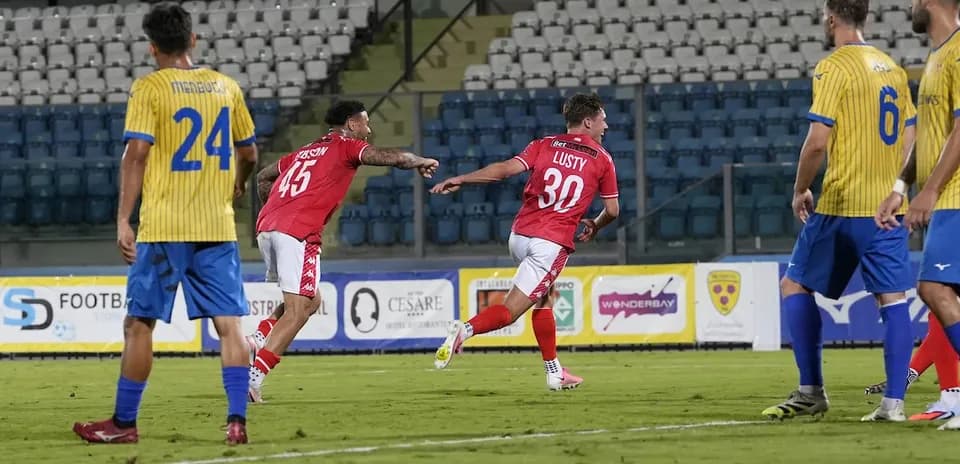 Players celebrating a goal during UEFA match