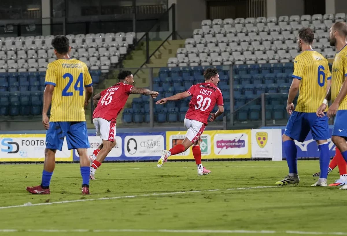 Players celebrating a goal during UEFA match