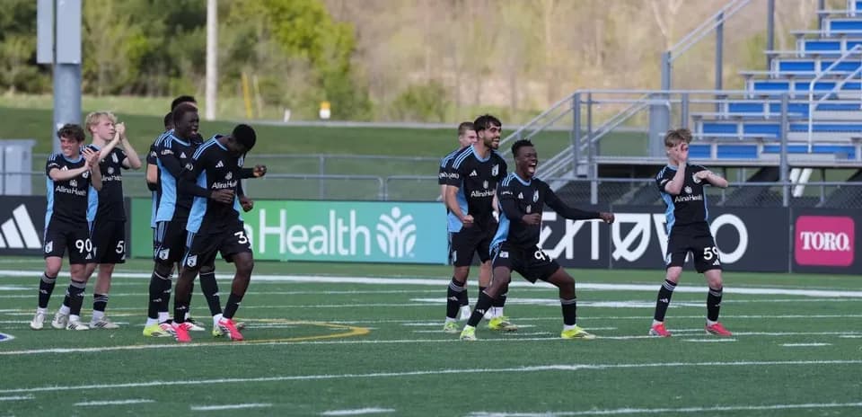 Minnesota United II players celebrating on the field