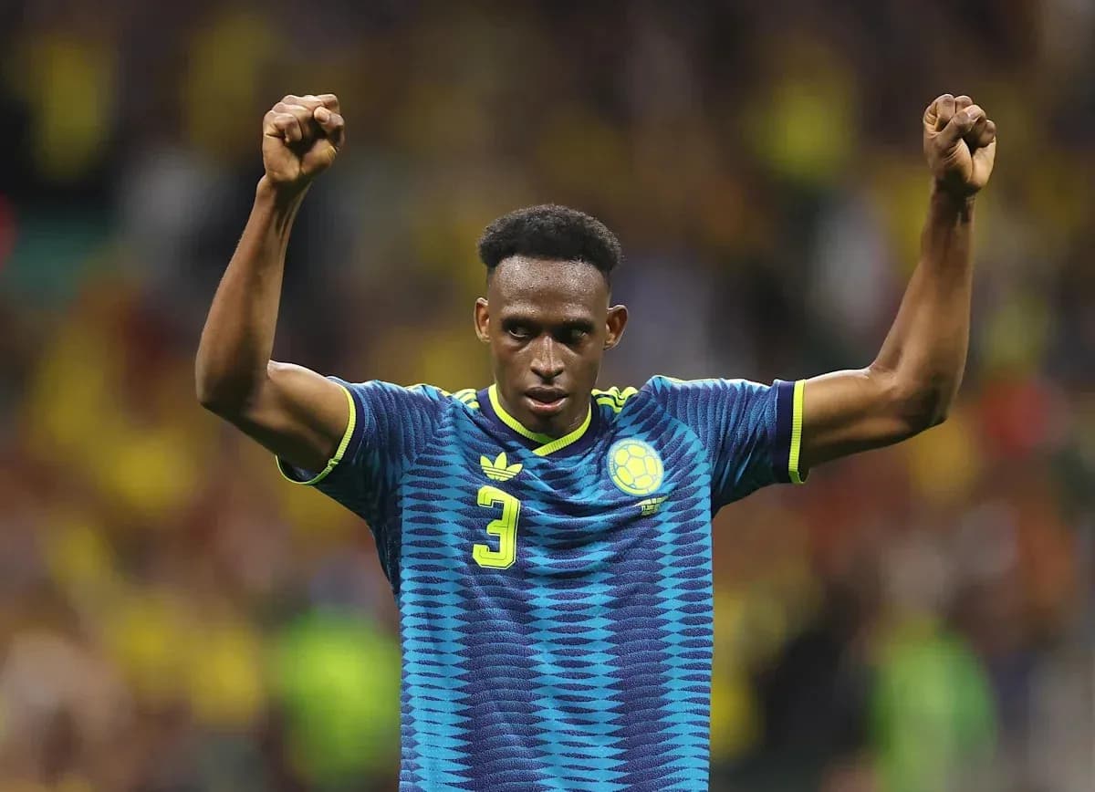 Player celebrating with raised fists on the field