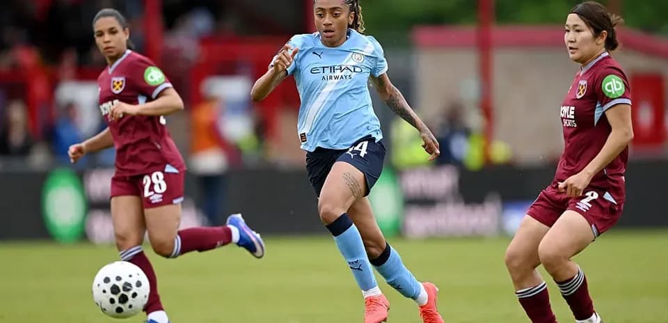 Player dribbling ball during match between teams