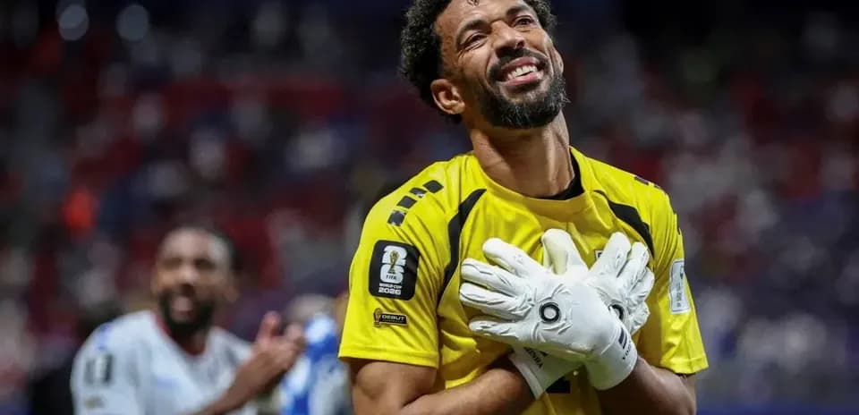 Goalkeeper celebrating with hands on heart