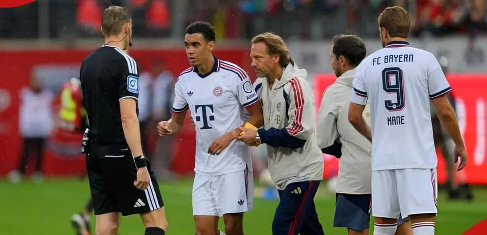 Bayern Munich players interacting with referee during match