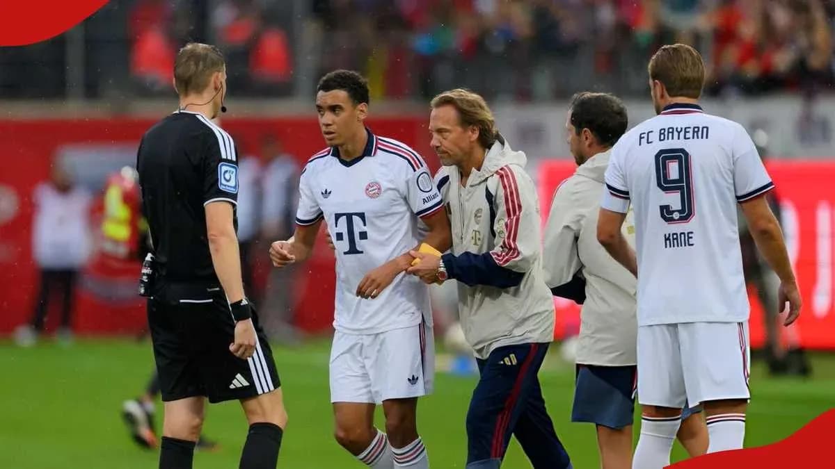 Bayern Munich players interacting with referee during match