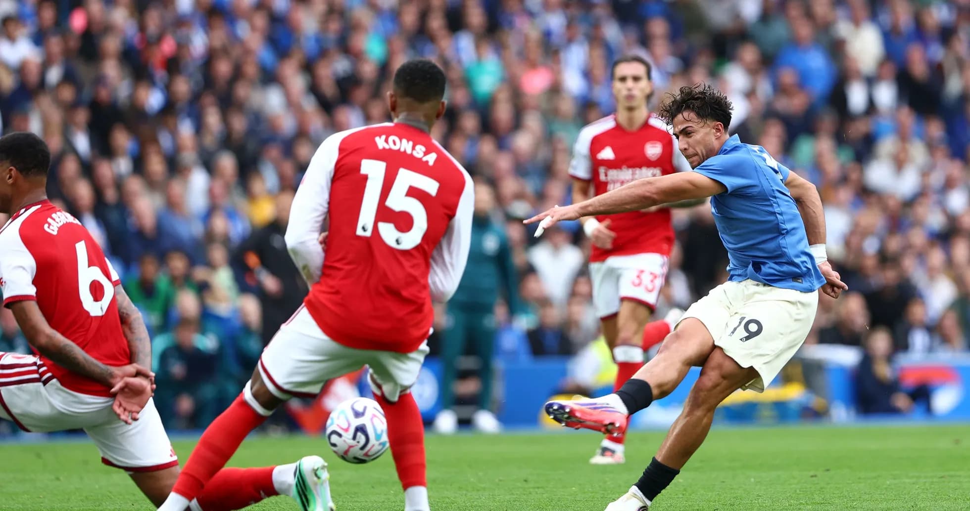 Player shooting the ball during match against Arsenal