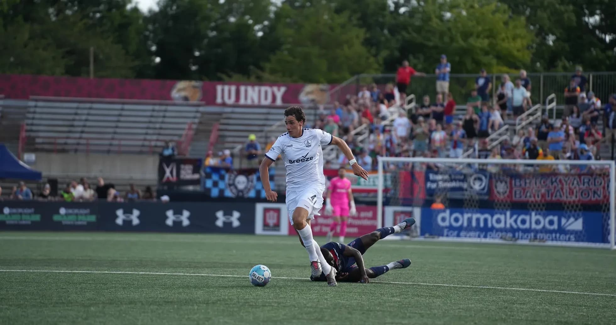 Player dribbling the ball during USL match
