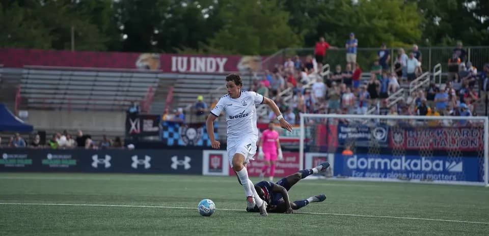 Player dribbling the ball during USL match