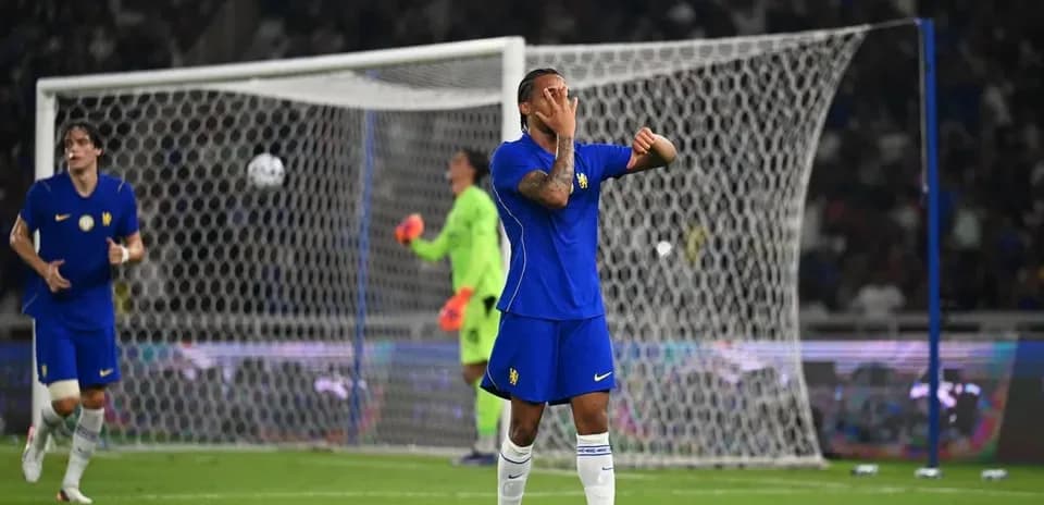 Player in blue jersey reacting during soccer match