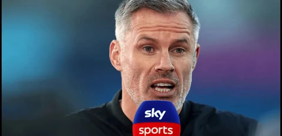 Presenter speaking into Sky Sports microphone on set
