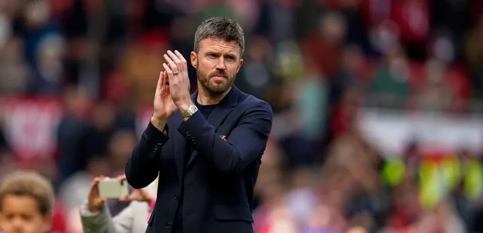 Coach applauding fans at the stadium