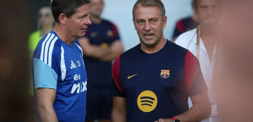 Two coaches discussing during a training session