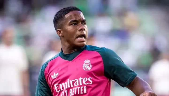 Player in Real Madrid training kit on field