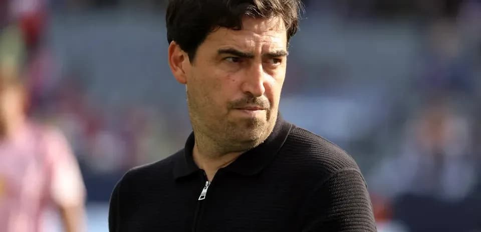 Coach observing the field before the match