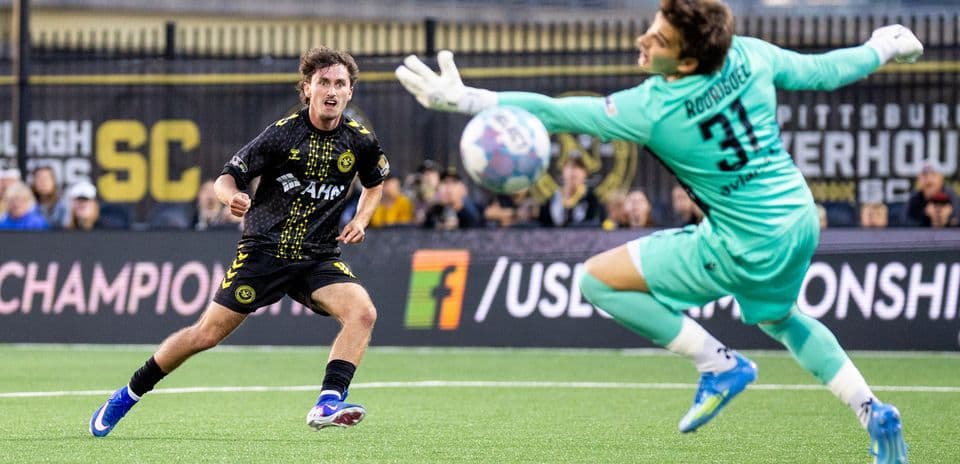Player shooting on goal against Miami FC
