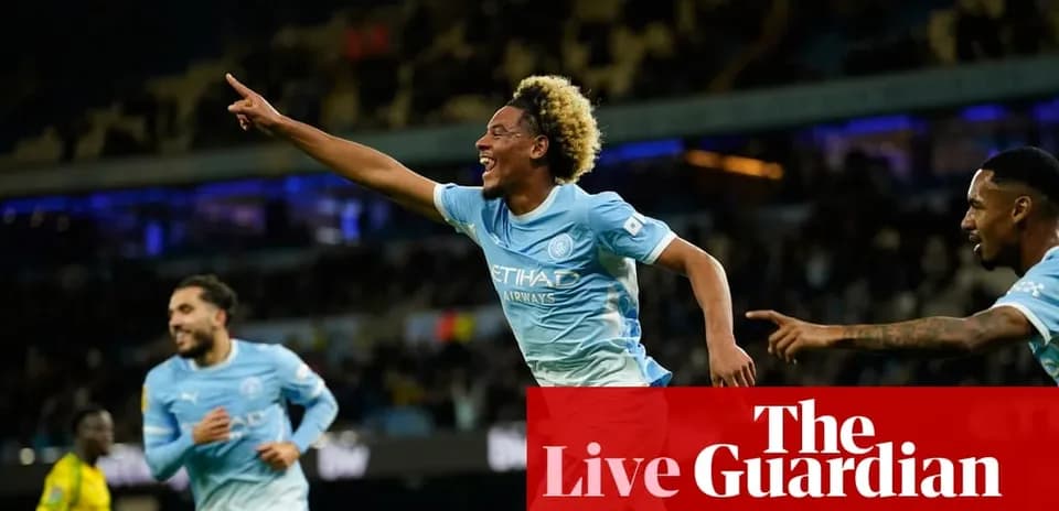 Player celebrating a goal with teammates at stadium