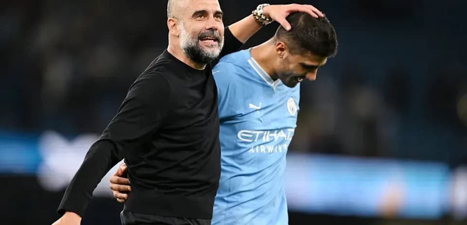 Manager and player celebrating after match victory