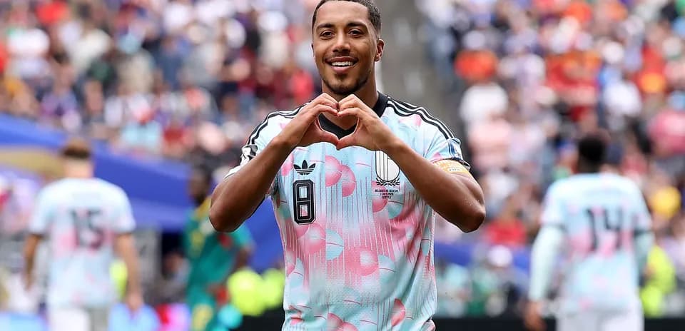 Player celebrating by making a heart gesture