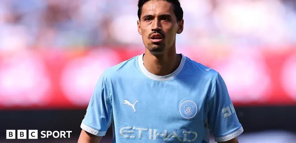 Player in light blue jersey on the pitch
