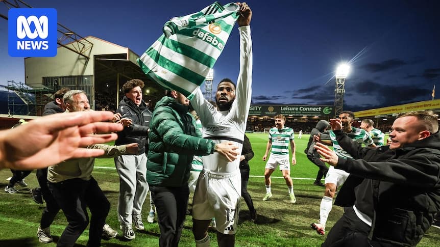 Player celebrating with fans after match victory