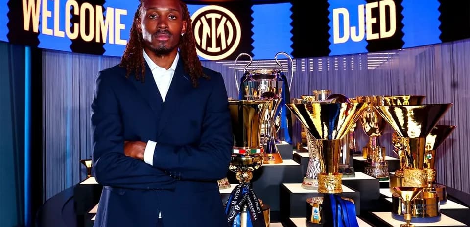 New player standing in front of trophies display