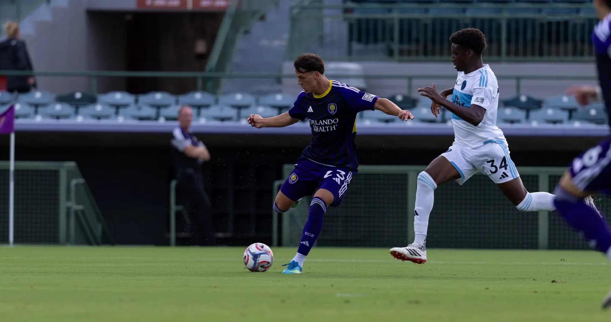Orlando City II player dribbling past opponent