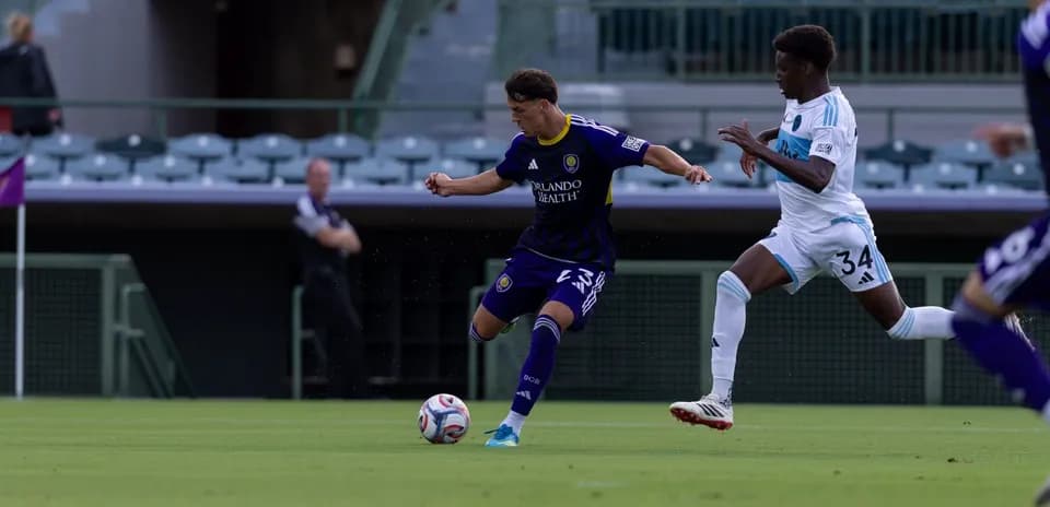 Orlando City II player dribbling past opponent