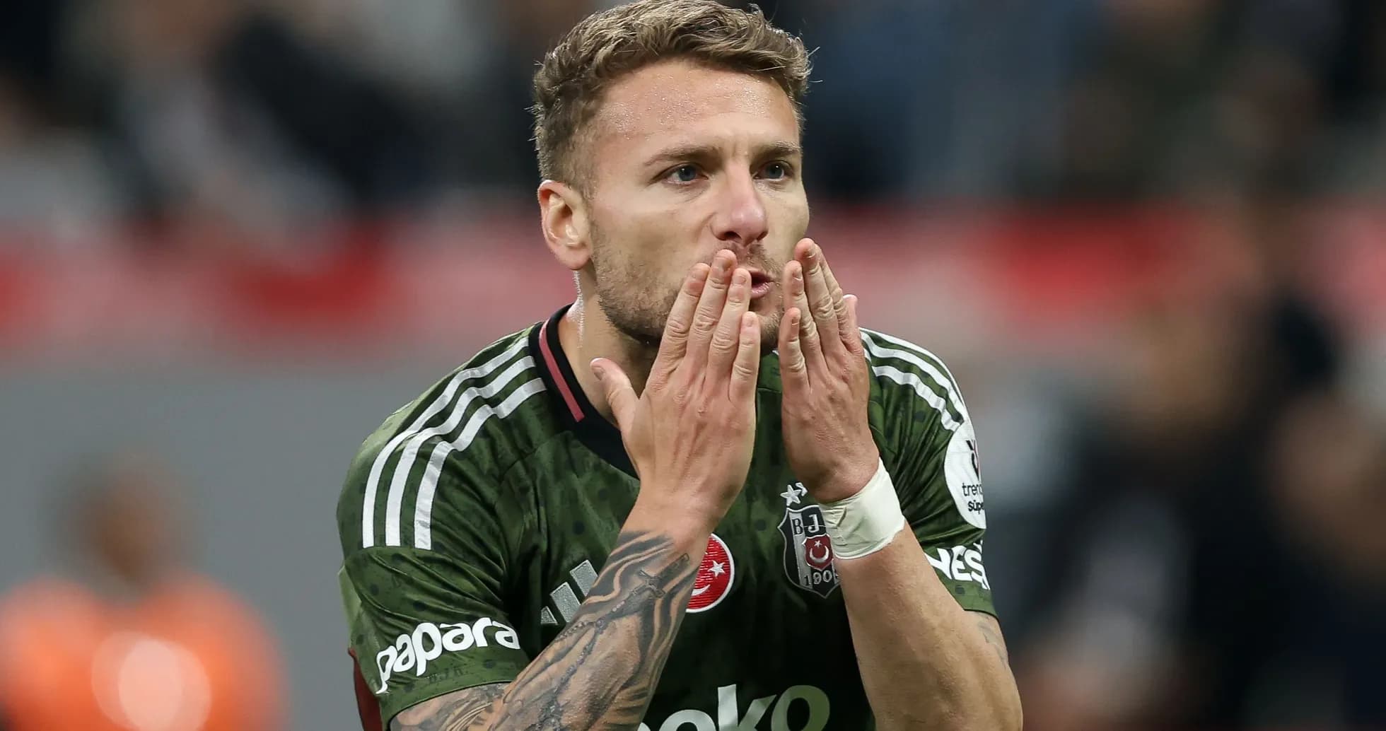 Player celebrating with hand gestures on the field