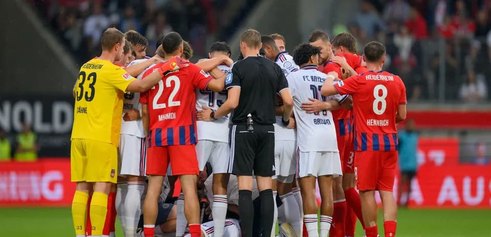 Players from both teams huddled during match