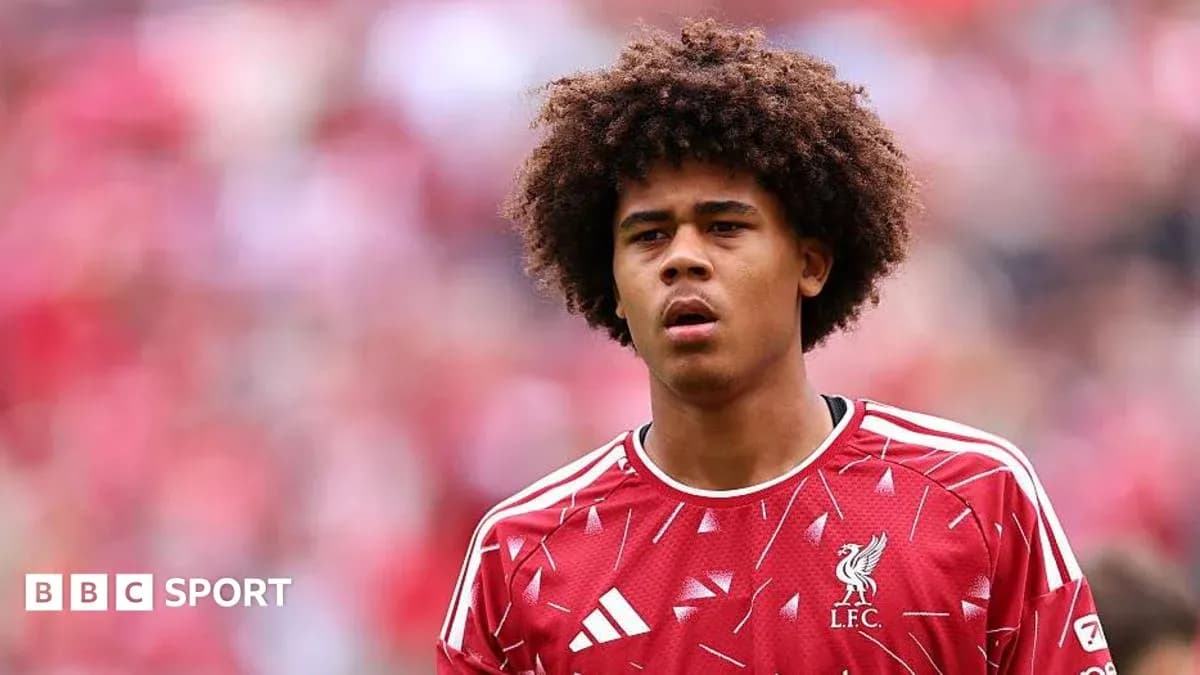 Player in Liverpool kit during match warm-up