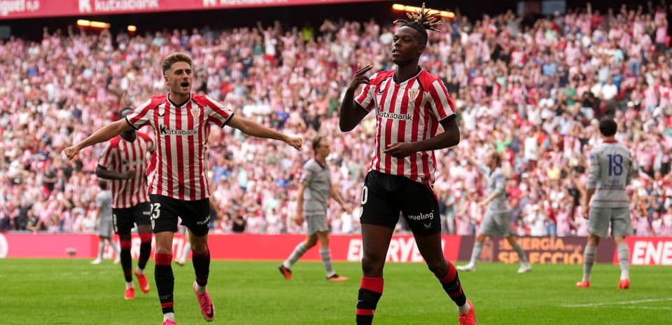 Athletic Bilbao players celebrating a goal in stadium