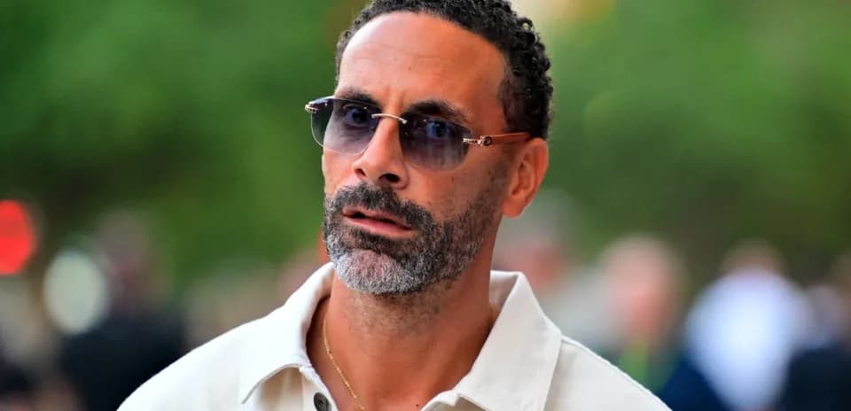Man wearing sunglasses walking outdoors