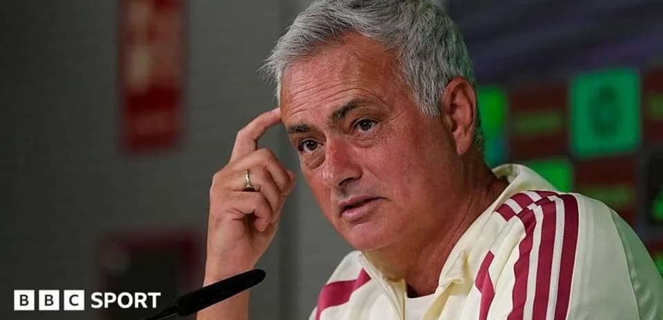 Manager speaking during press conference at podium