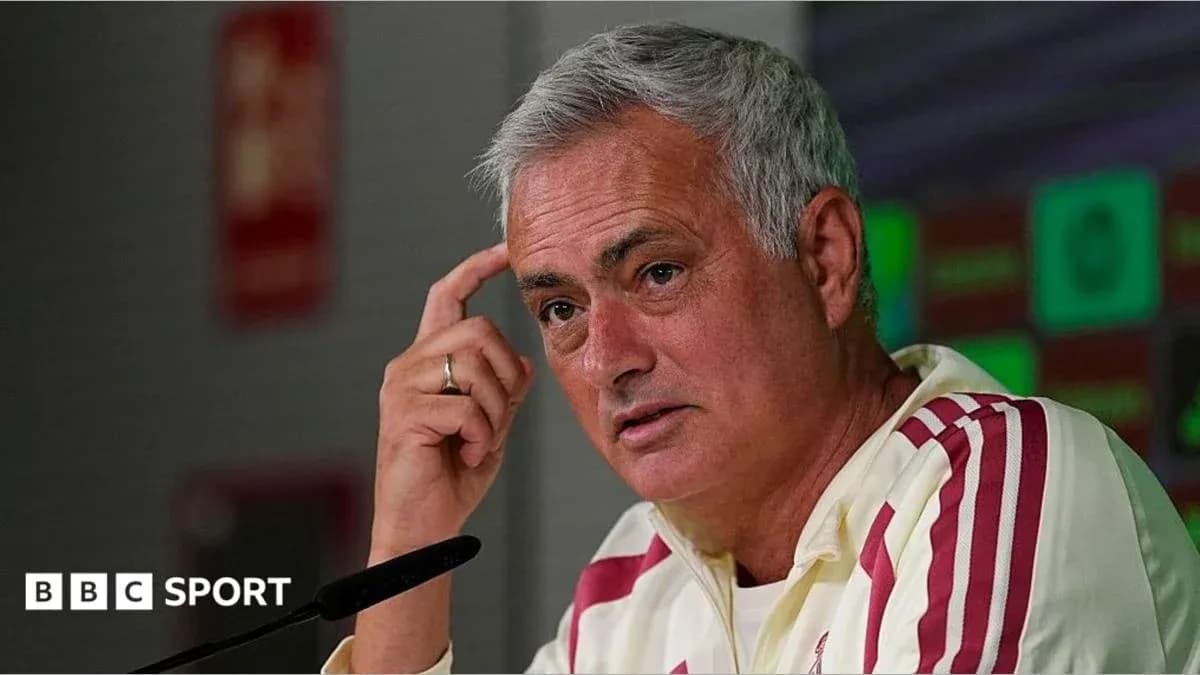 Manager speaking during press conference at podium