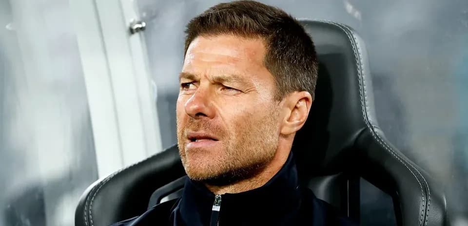 Coach sitting on bench during match observation