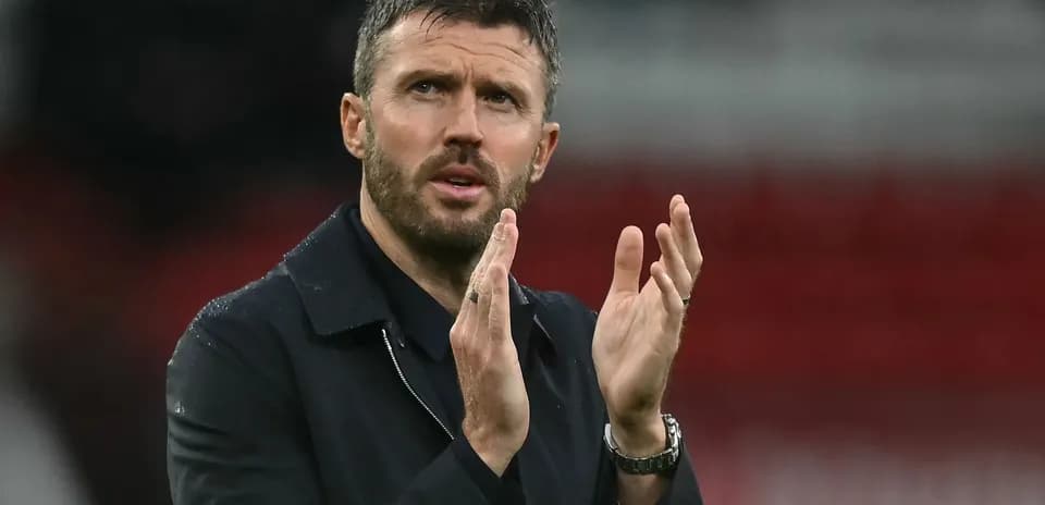 Coach applauding during a match on the sidelines