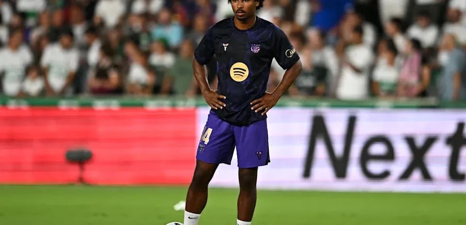 Player preparing to take a free kick on field