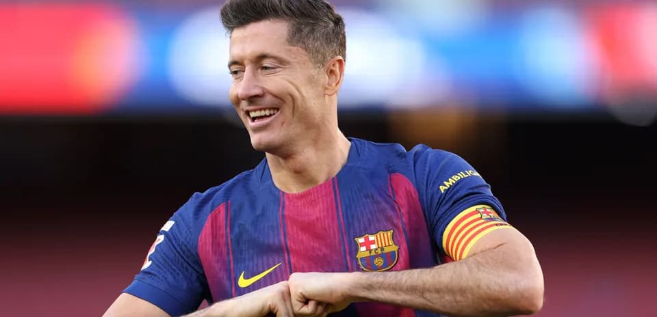 Player in FC Barcelona jersey smiling on field