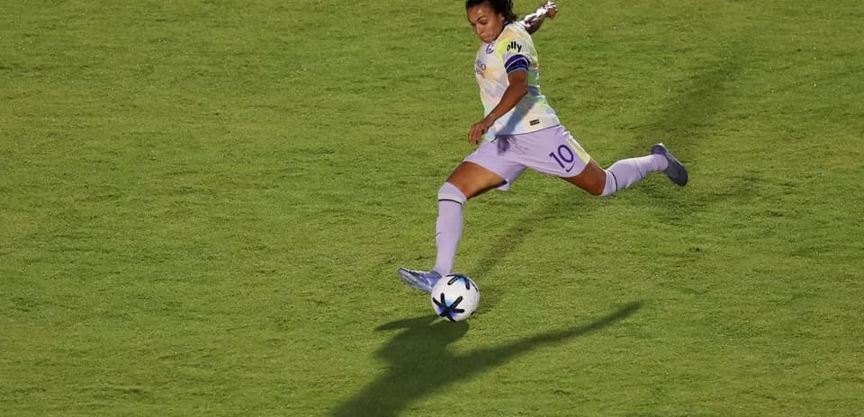 Player kicking ball during Racing Louisville match