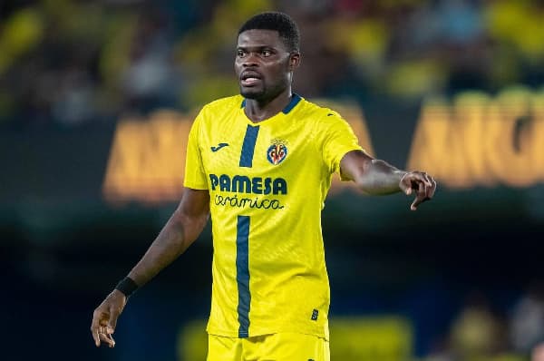 Player in yellow jersey gesturing on the field